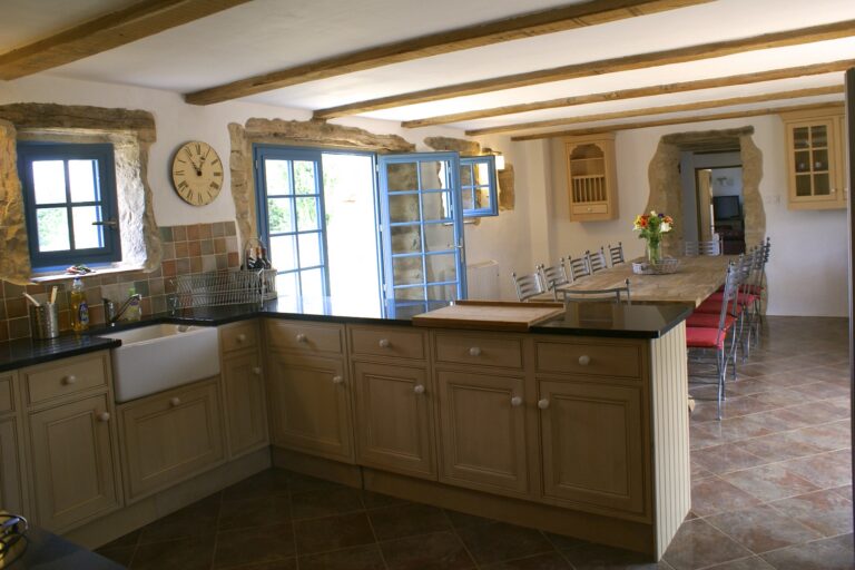 The kitchen looking across the worktop to the dining table beyond