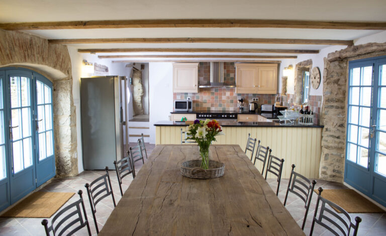 The kitchen and dining room, with an oak table seating twelve